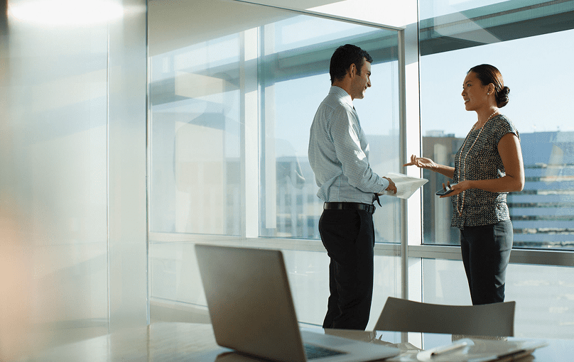 Business conversation in modern office setting