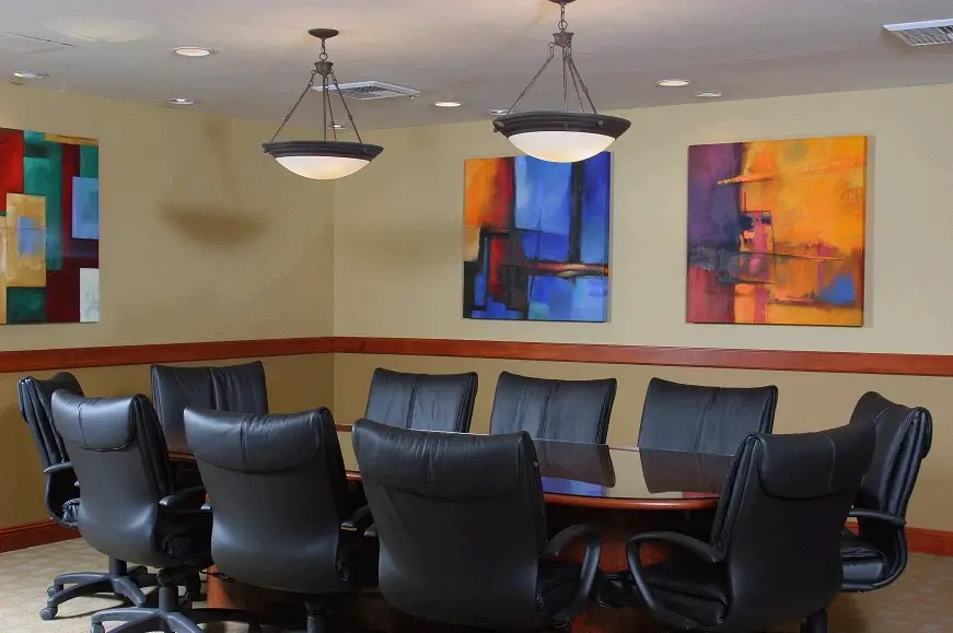 Boardroom with black leather swivel chairs